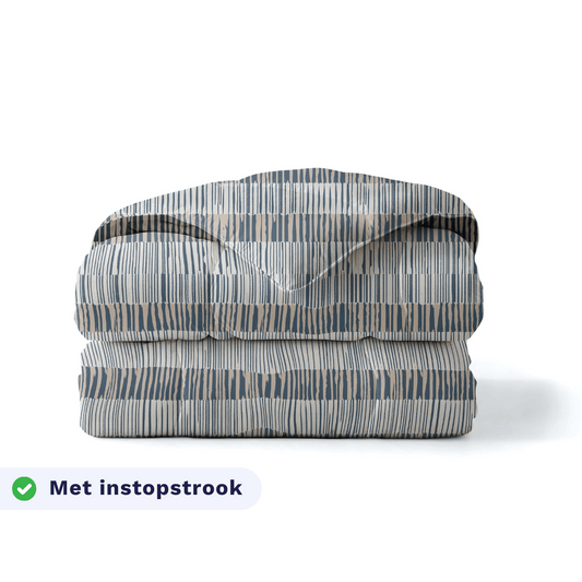 Zelesta Pure Design Cotton Duvet in Checkerboard folded on a white background, with a badge highlighting the integrated tuck-in flap feature