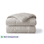 Zelesta Pure Design Cotton Duvet in Ethnic Cream folded on a white background, with a badge highlighting the integrated tuck-in flap feature