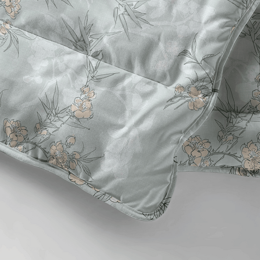 Close-up detail of the Zelesta Everyday Design Summer Duvet - Aqua Forest, showing the delicate floral and bamboo leaf print in soft aqua and grey tones