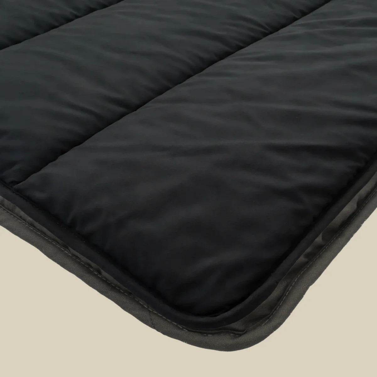 Zelesta Comfort Uni Duvet in Black, neatly folded on a white background showing the soft black microfiber fabric