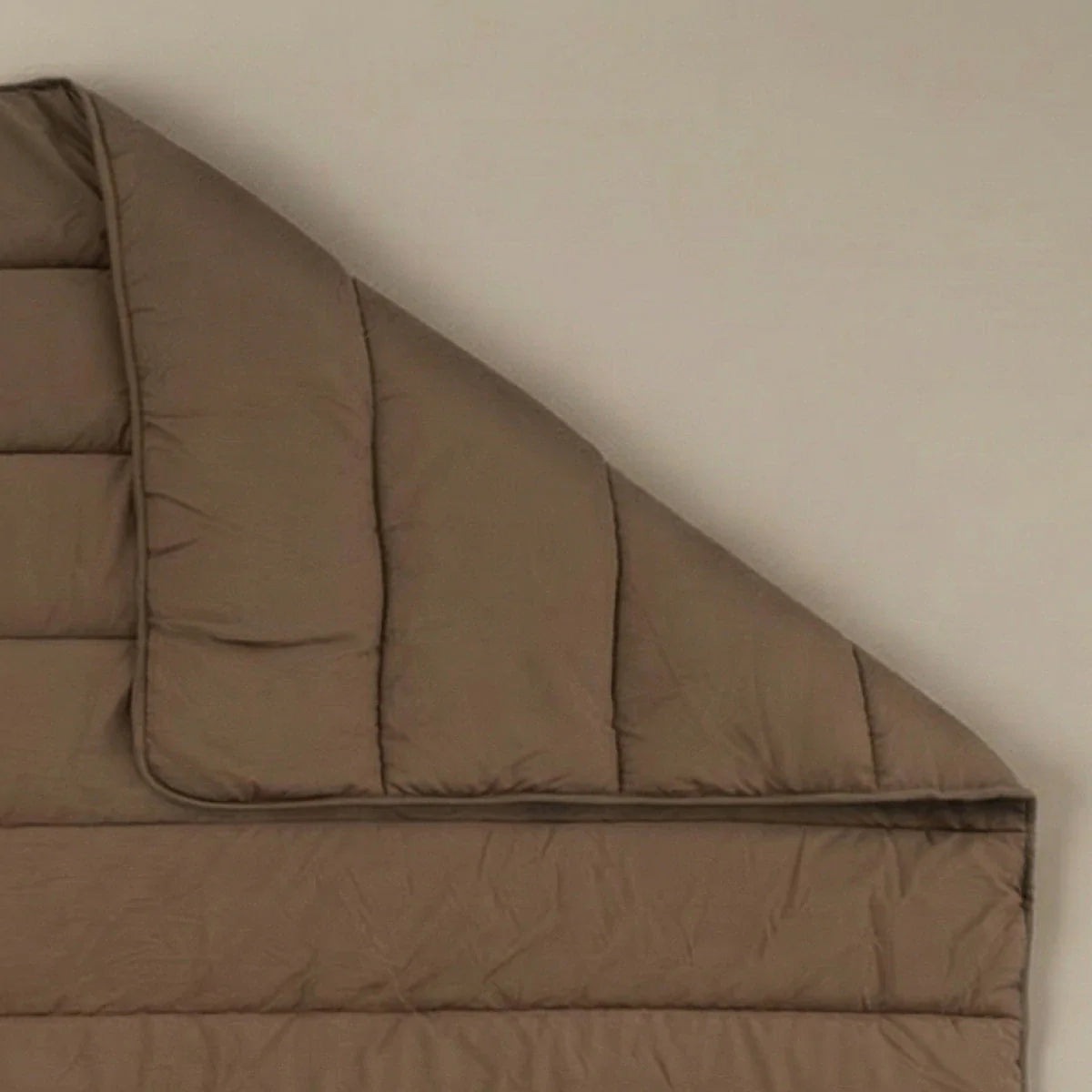Zelesta Comfort Uni Summer Duvet in Mocha, neatly folded on a white background showing the soft mocha microfiber fabric