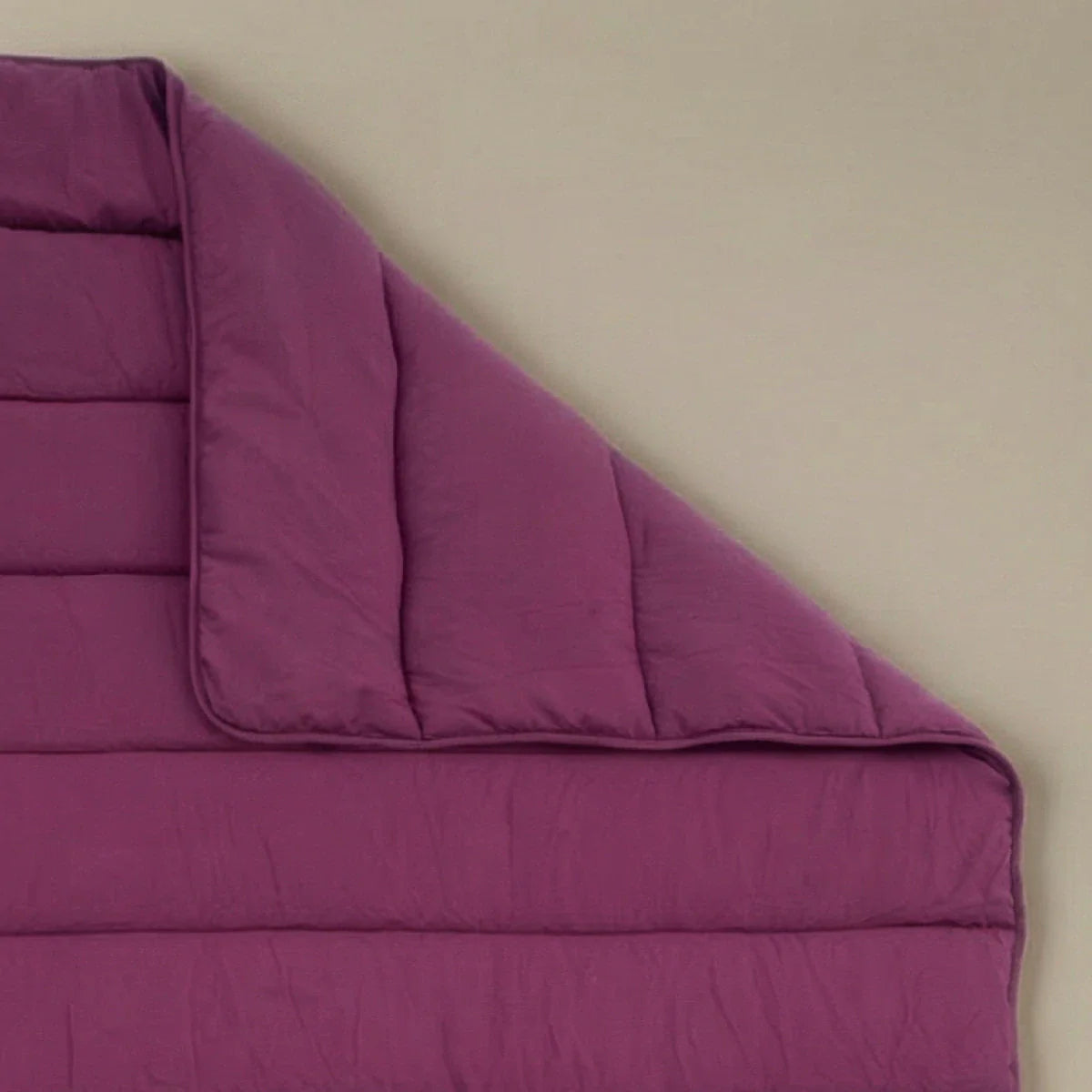 Zelesta Comfort Uni Duvet in Bordeaux, neatly folded on a white background showing the soft bordeaux microfiber fabric
