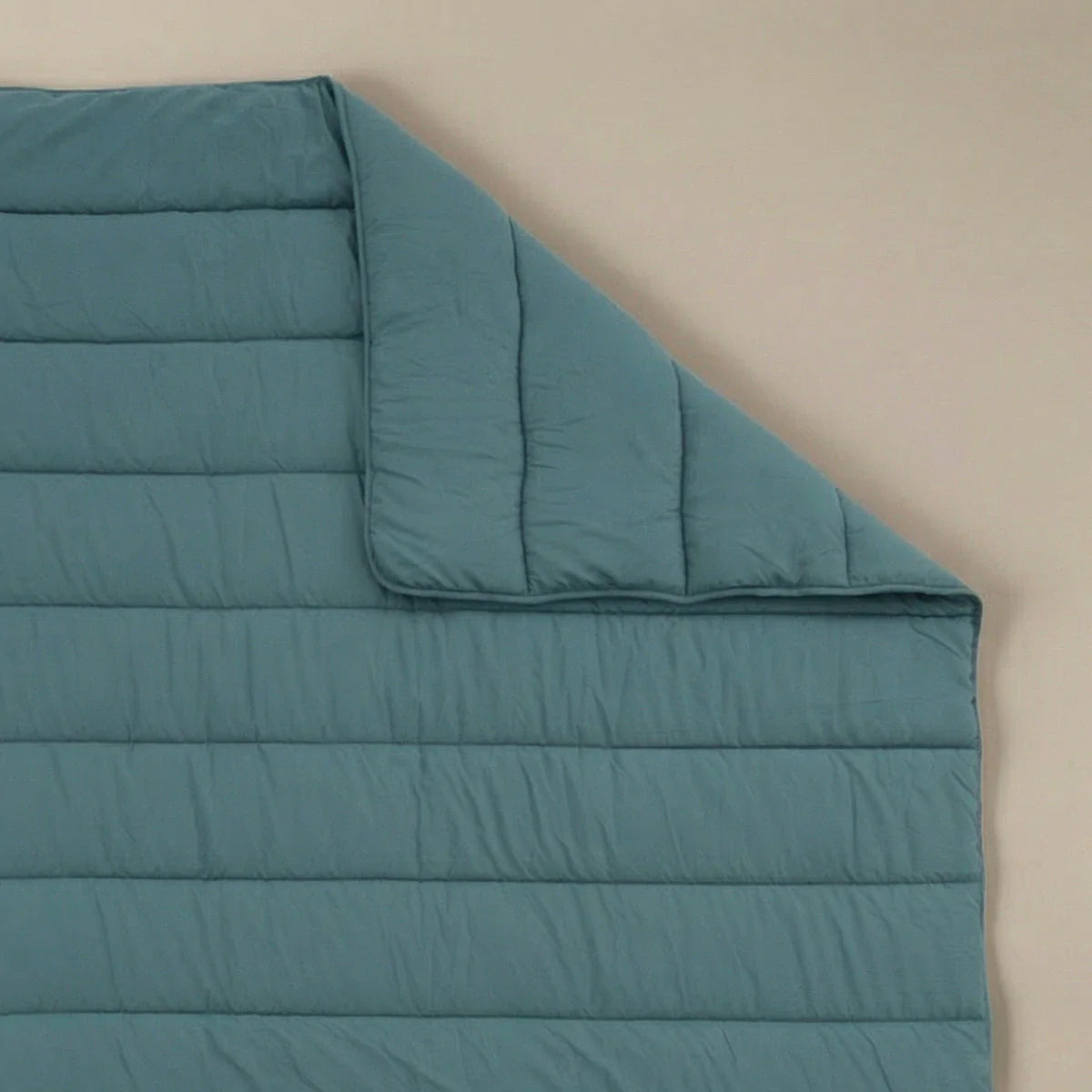 Zelesta Comfort Uni Summer Duvet in Sea Green, neatly folded on a white background showing the soft sea green microfiber fabric