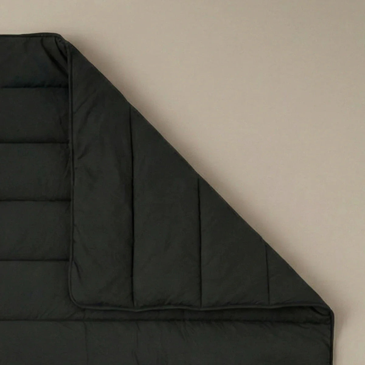 Zelesta Comfort Uni Summer Duvet in Black, neatly folded on a white background showing the soft black microfiber fabric