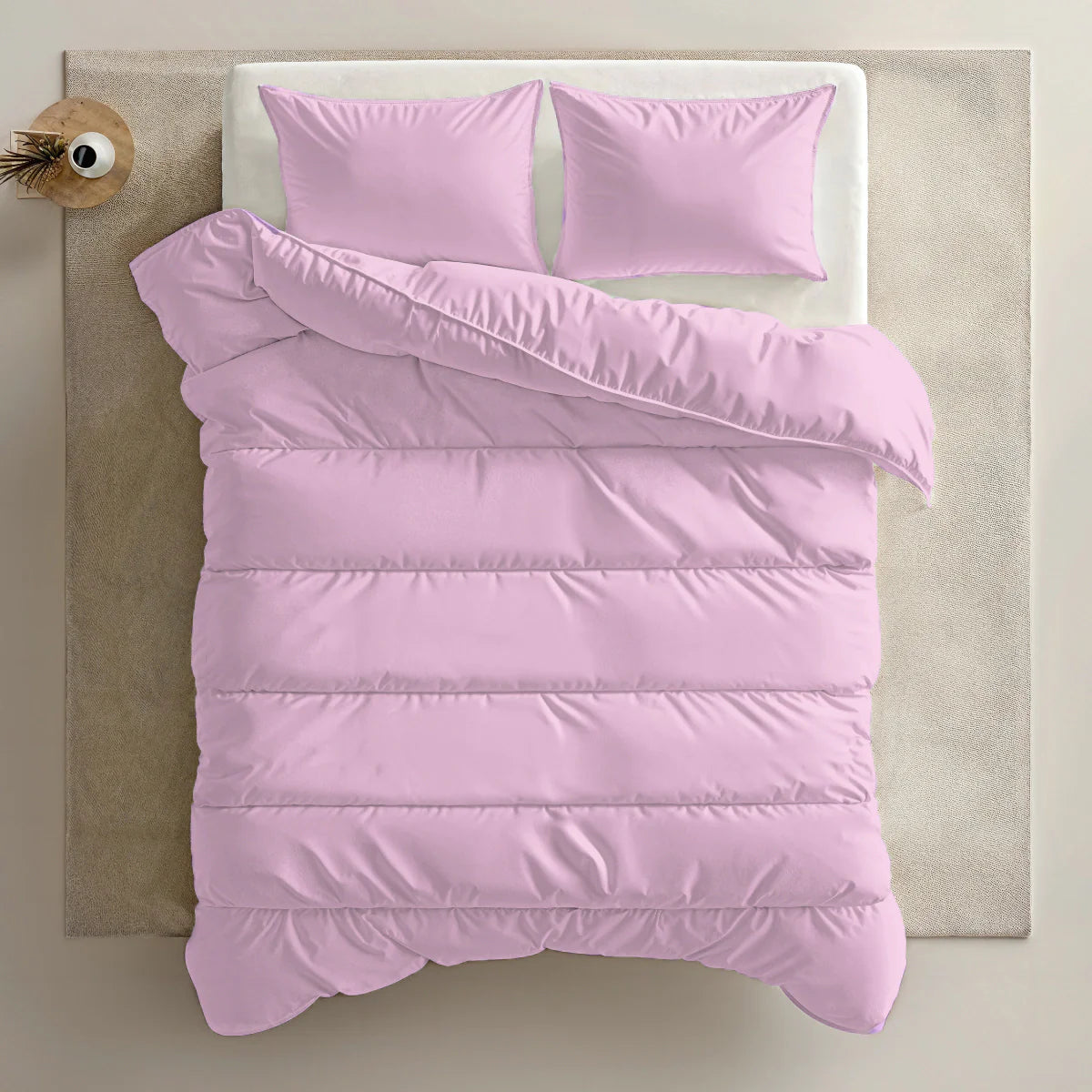 Zelesta Everyday Uni Duvet in Pastel Pink, close-up of the folded duvet showing the smooth pastel pink microfiber texture
