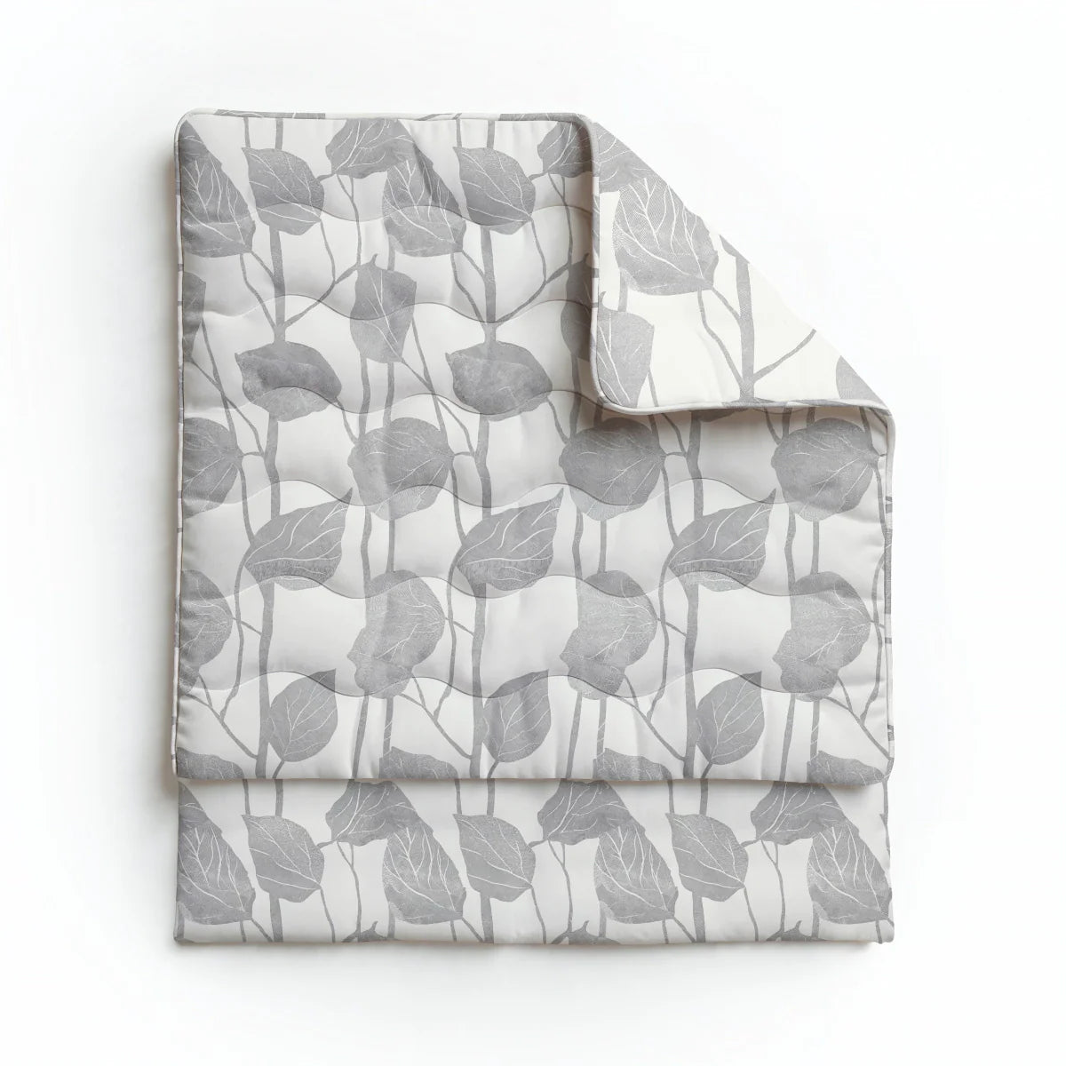 Overhead flat lay of the Zelesta Pure Design Cotton Duvet in Spring Buds on a white background with one corner folded back to reveal the inside