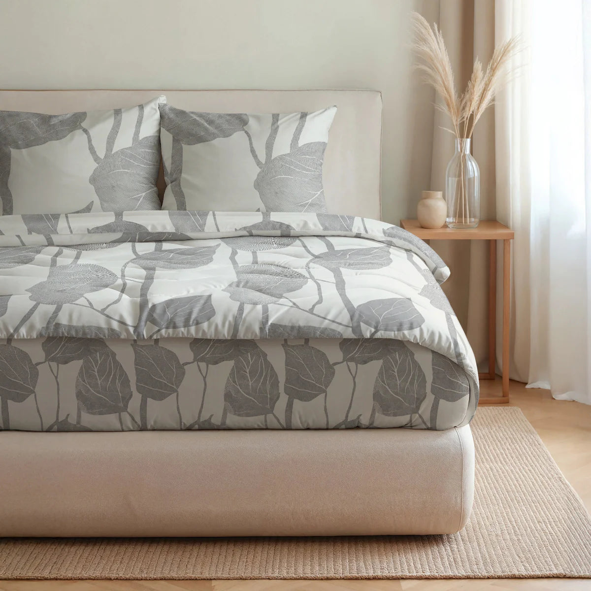 Side-on lifestyle view of the Zelesta Pure Design Cotton Duvet in Spring Buds and matching pillowcases on a bed in a styled bedroom
