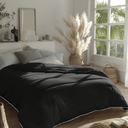 Zelesta Everyday Uni Duvet in Black, close-up of the folded duvet showing the smooth black microfiber texture
