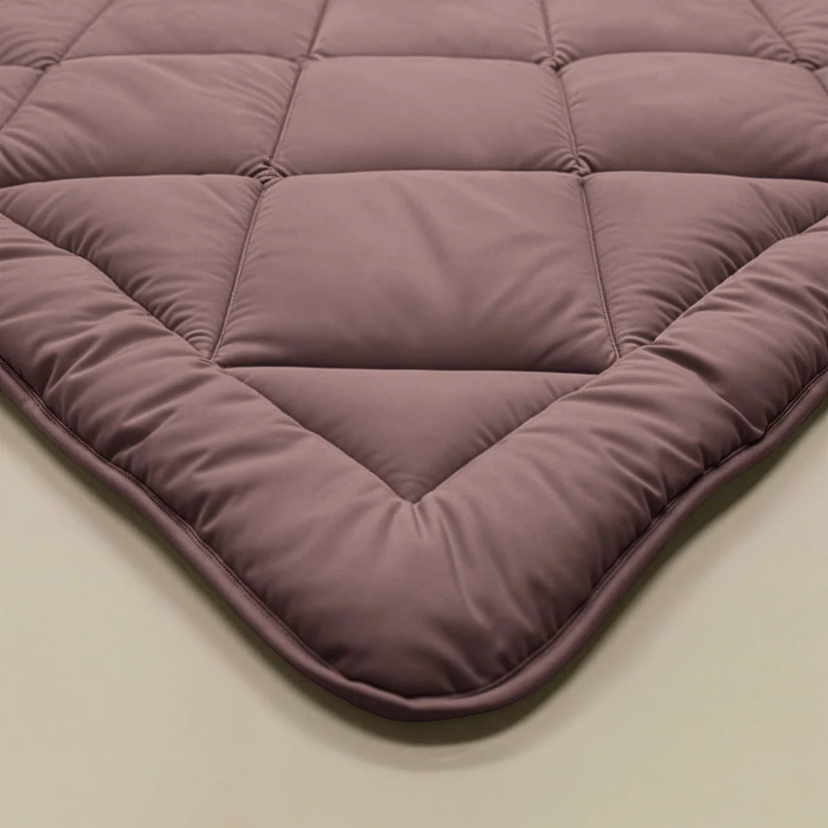 Zelesta Comfort Uni Diamond Duvet in Bordeaux on a neatly made bed