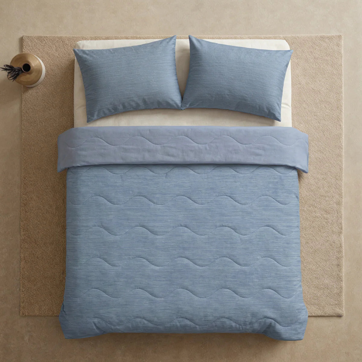 Close-up lifestyle view of the Zelesta Special Cooling Blend Summer Duvet - Serene Blue on a styled bed