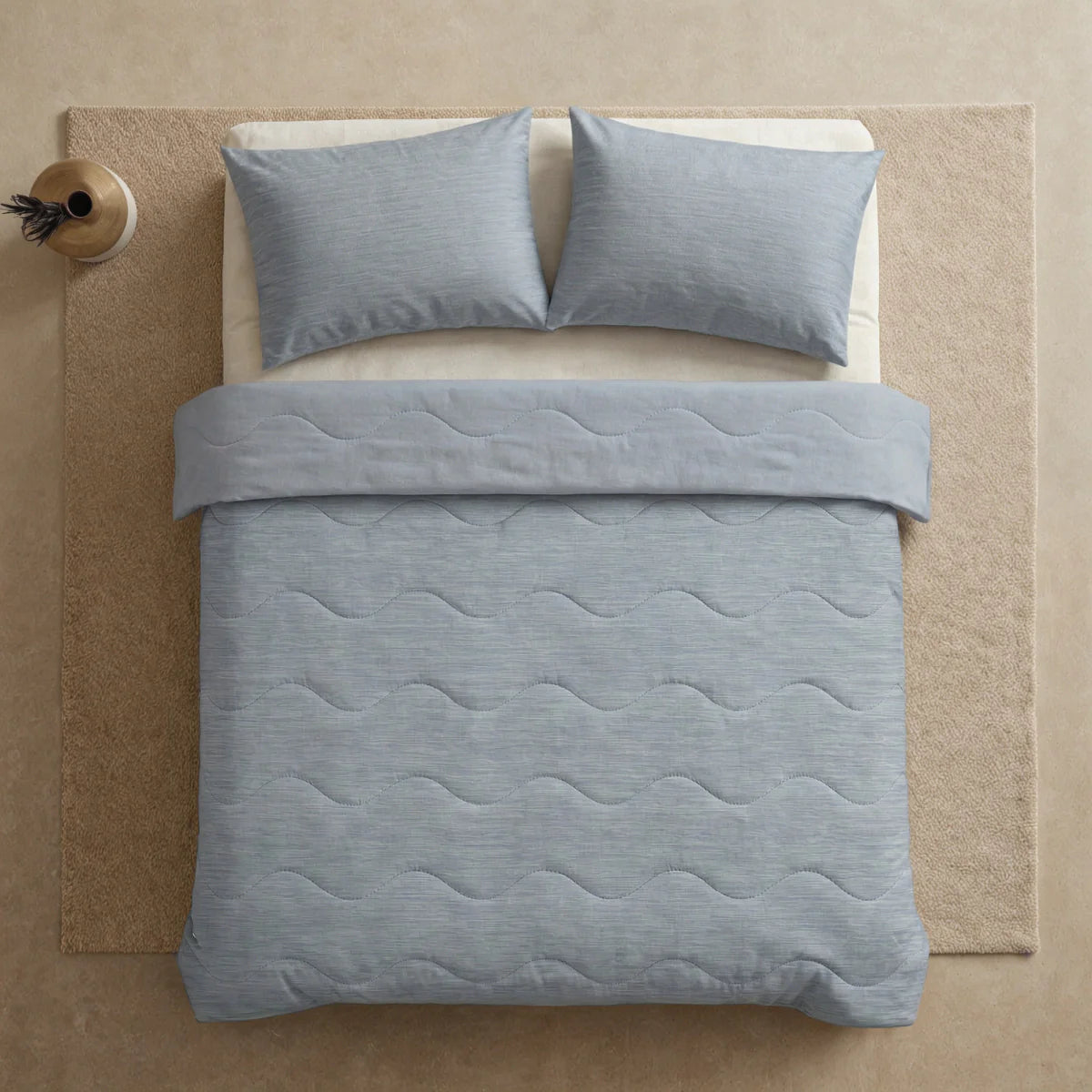 Close-up lifestyle view of the Zelesta Special Cooling Blend Summer Duvet - Warm Grey Linen on a styled bed