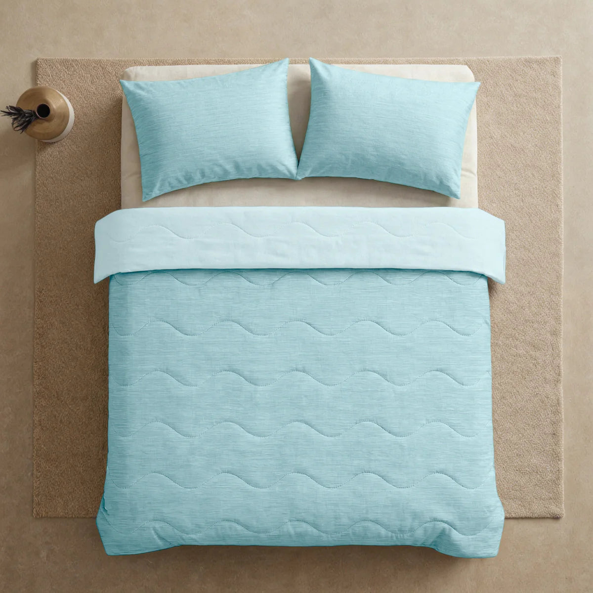 Close-up lifestyle view of the Zelesta Special Cooling Blend Summer Duvet - Fresh Mint Green on a styled bed