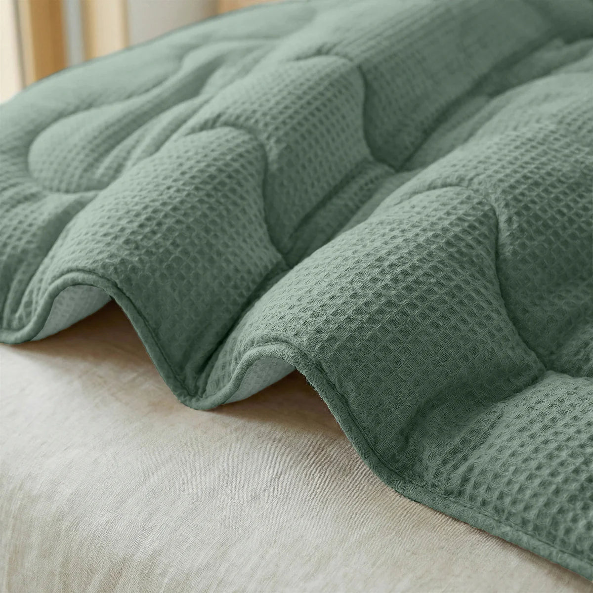 Close-up of the cooling fabric texture of the Zelesta Special Cooling Serene Summer Duvet in Sage Green