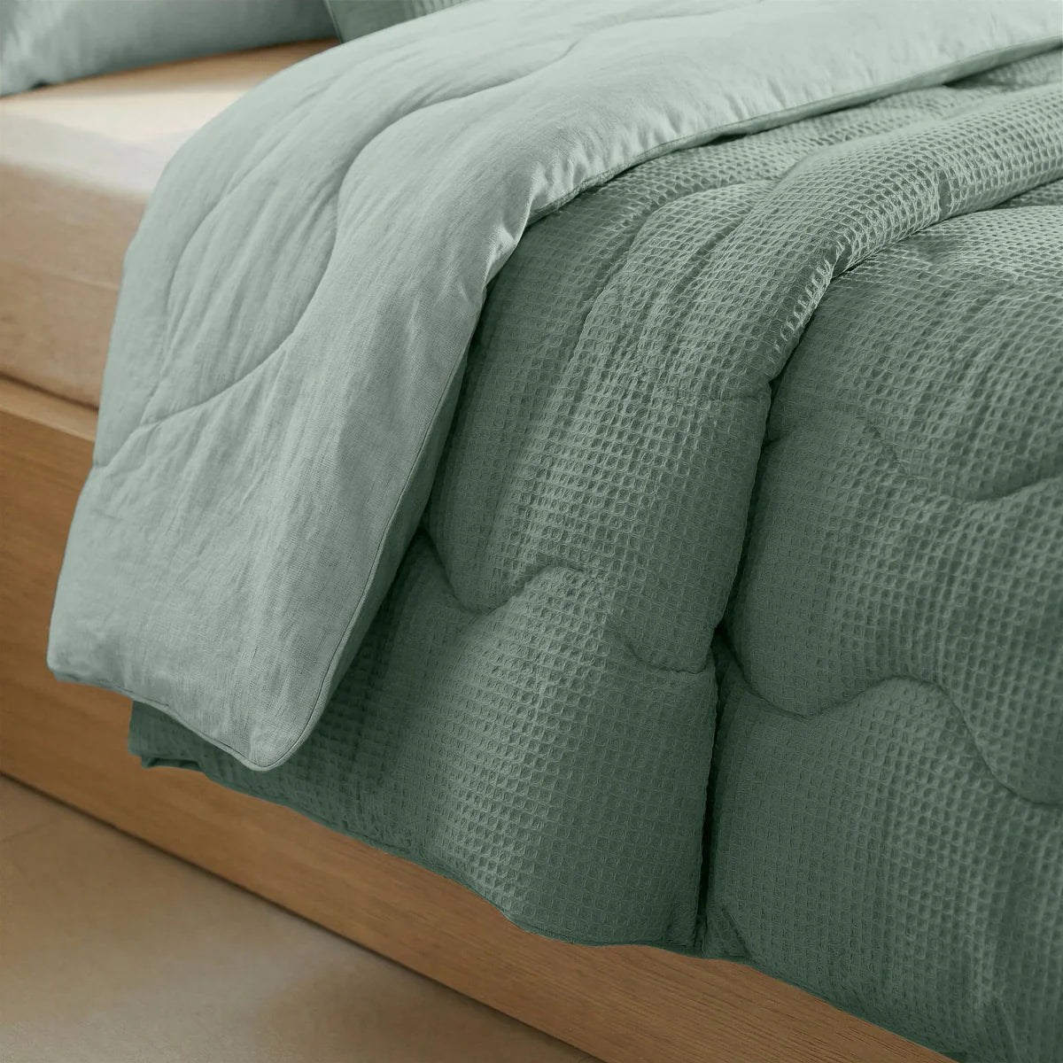 Close-up of the cooling fabric texture of the Zelesta Special Cooling Serene Summer Duvet in Sage Green