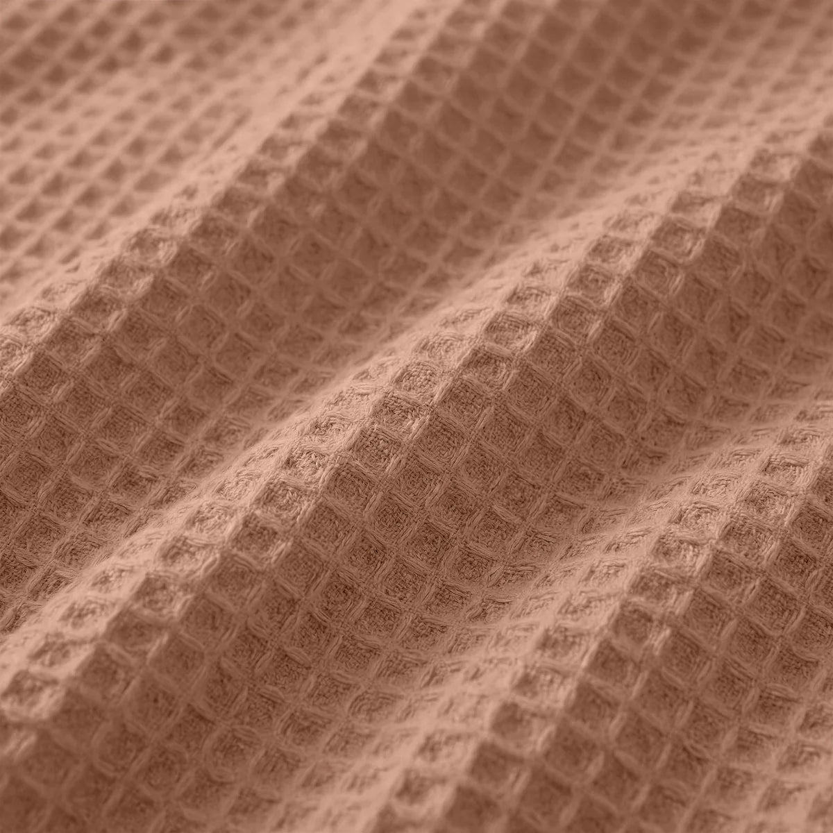 Close-up of the cooling fabric texture of the Zelesta Special Cooling Serene Summer Duvet in Terracotta Pink