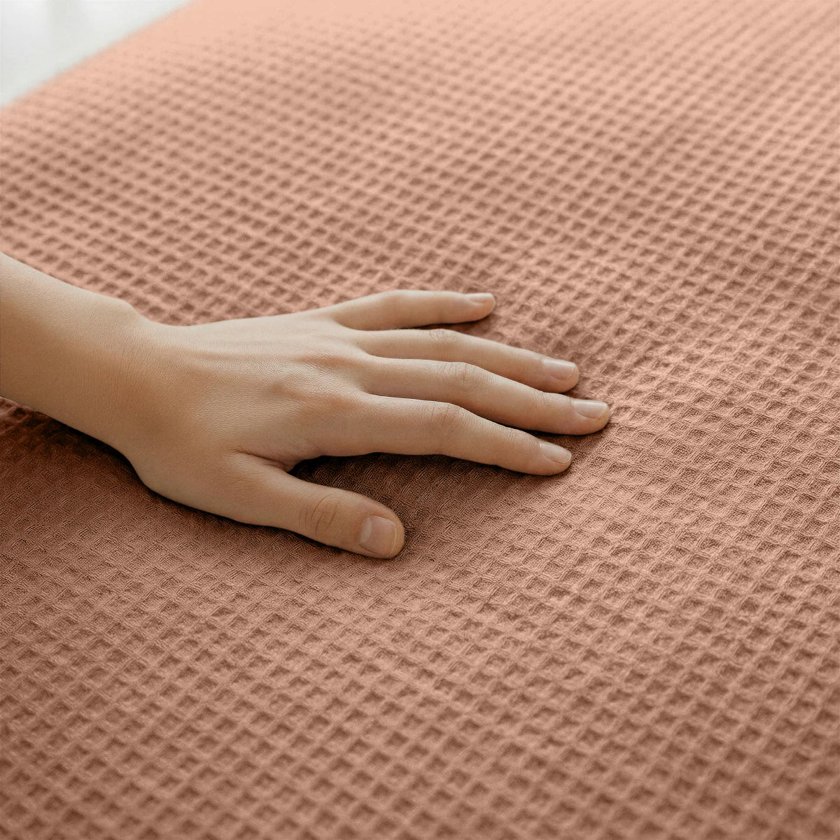 Close-up of the cooling fabric texture of the Zelesta Special Cooling Serene Summer Duvet in Terracotta Pink