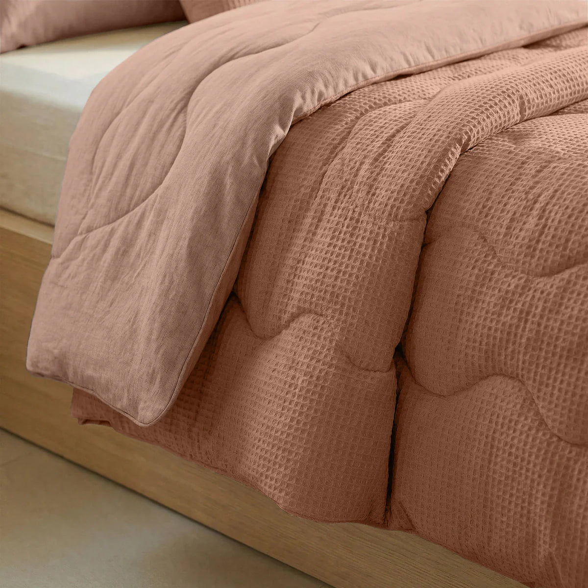 Close-up of the cooling fabric texture of the Zelesta Special Cooling Serene Summer Duvet in Terracotta Pink