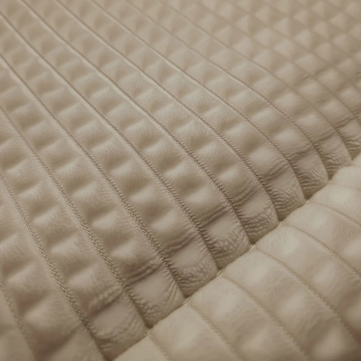 Close-up of the waffle-grid teddy fabric texture of the Zelesta Special Teddy Check Duvet in Taupe